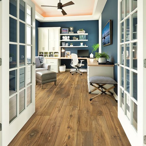 open french doors leading to office with wide plank natural looking wood floors